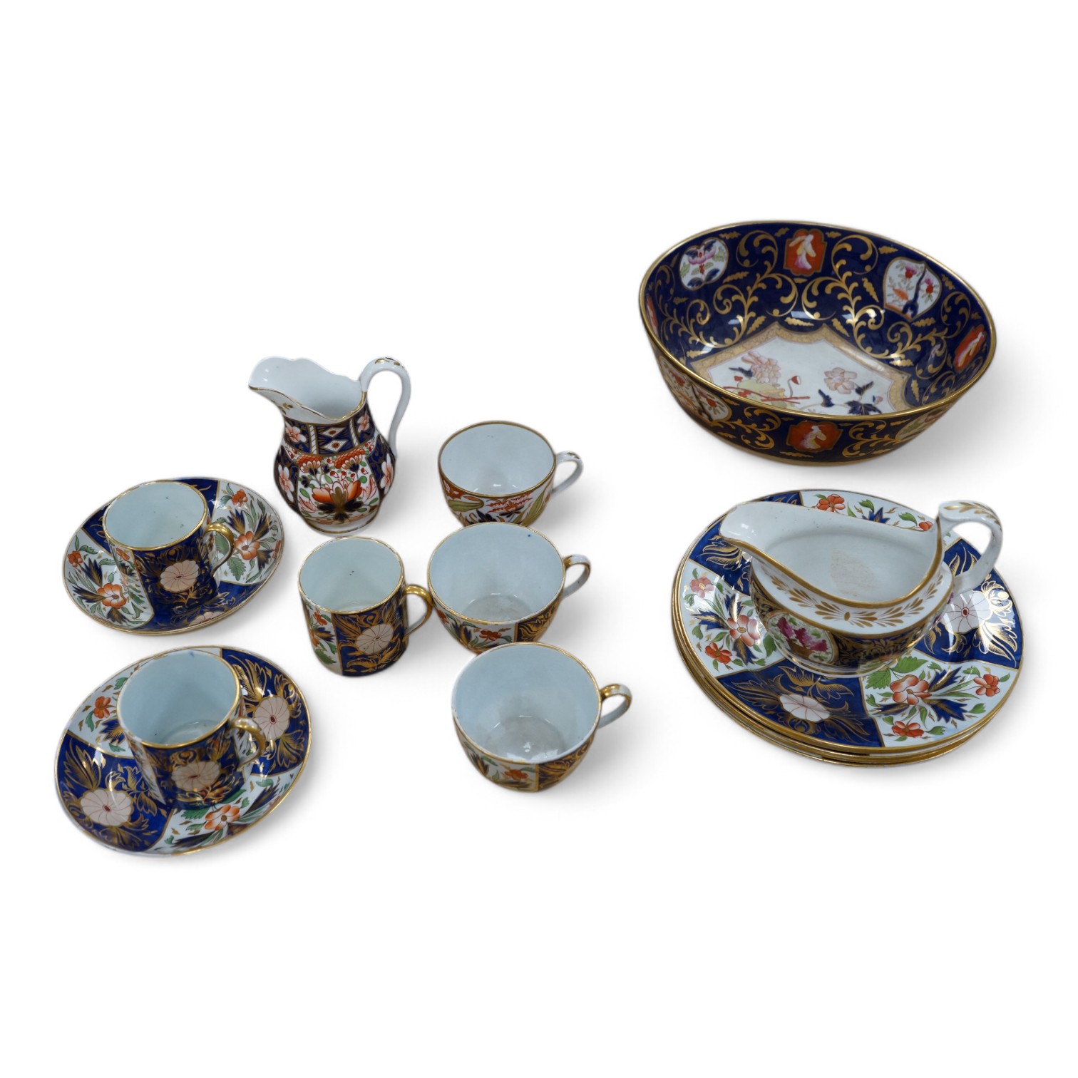 A Wedgwood Queensware Imari part tea set and a Masons Imari pattern bowl, bowl 25.5cm diameter. Condition - some wear to gilt decoration and crazing to interior of jug